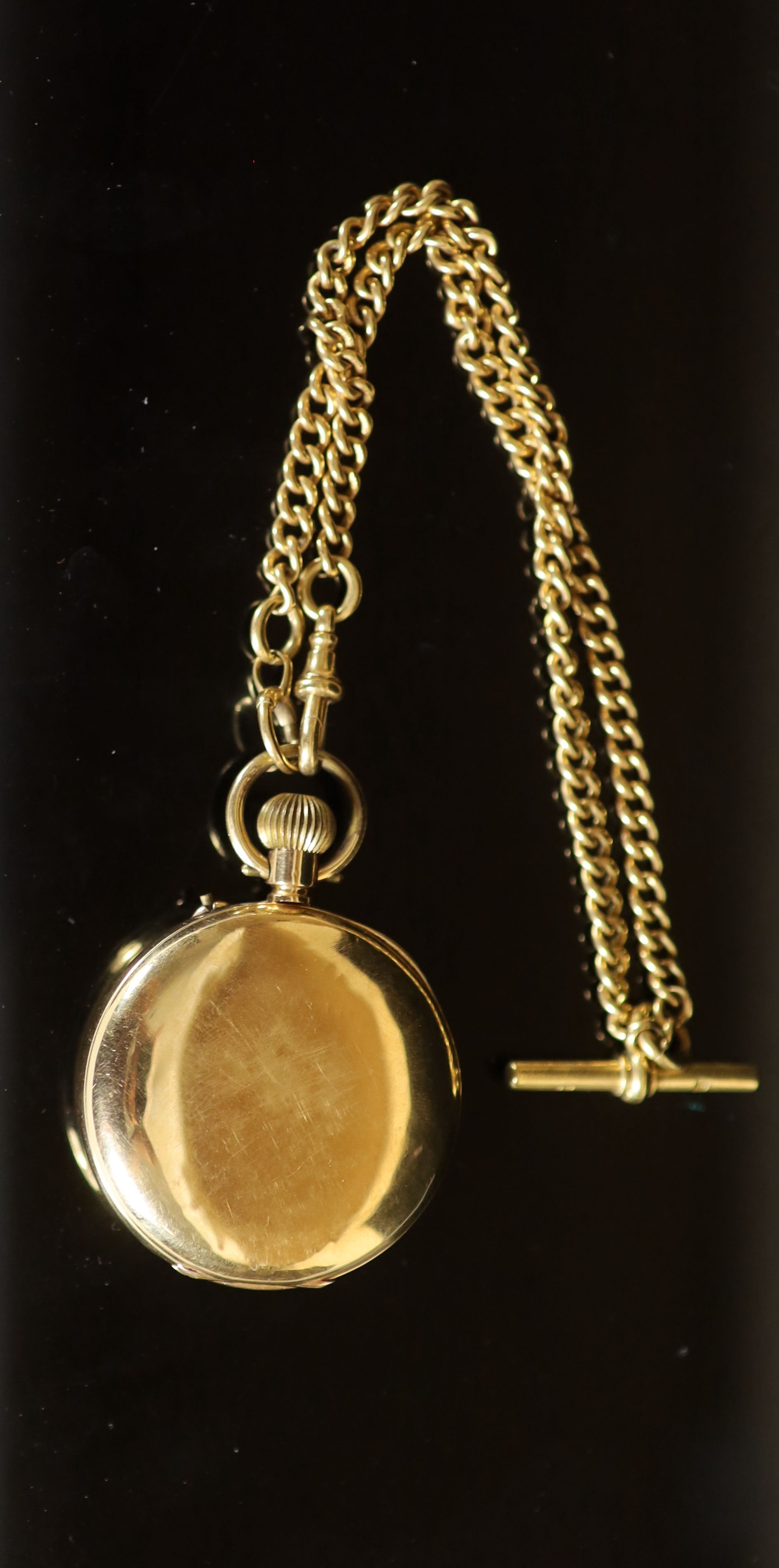 A late 19th/early 20th century 18K gold half hunter keyless pocket watch, by William Greenwood of Leeds, together with an 18ct gold curblink albert